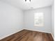 Bedroom featuring wood-look flooring and a window with blinds at 264 Ascott Ln, Woodstock, GA 30189