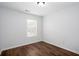 Bedroom featuring wood-look flooring and a window with blinds at 264 Ascott Ln, Woodstock, GA 30189