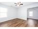 Bedroom features wood floors and natural light at 264 Ascott Ln, Woodstock, GA 30189