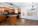 Bright eat-in kitchen features wood cabinets, stainless steel appliances, and island at 264 Ascott Ln, Woodstock, GA 30189
