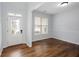 Inviting living room featuring hardwood floors, a large window, and neutral paint at 264 Ascott Ln, Woodstock, GA 30189