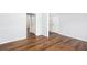Spacious room featuring hardwood floors and multiple doors at 264 Ascott Ln, Woodstock, GA 30189