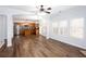 Open living space featuring hardwood floors, a modern kitchen, and natural light at 264 Ascott Ln, Woodstock, GA 30189