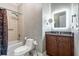 Bathroom featuring stylish granite countertops, recessed vanity, and shower-tub combo at 3280 Stillhouse Se Ln # 101, Atlanta, GA 30339