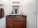 Bathroom vanity with dark wood cabinets, granite countertop, and modern fixtures at 3280 Stillhouse Se Ln # 101, Atlanta, GA 30339