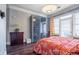 Bedroom view featuring hardwood floors, natural light, modern closet doors, and decor at 3280 Stillhouse Se Ln # 101, Atlanta, GA 30339