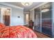 Bedroom featuring modern closet doors, wooden flooring and ensuite bathroom access at 3280 Stillhouse Se Ln # 101, Atlanta, GA 30339