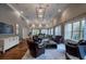 Community room with high ceilings, hard wood floors, several seating areas, and light fixtures at 3280 Stillhouse Se Ln # 101, Atlanta, GA 30339