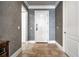 A bright entryway featuring gray walls, tiled floor, and a white front door with sidelights at 3280 Stillhouse Se Ln # 101, Atlanta, GA 30339