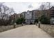 Brick apartment building with multiple stories, balconies and lush green spaces at 3280 Stillhouse Se Ln # 101, Atlanta, GA 30339