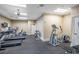 Community gym featuring treadmills, ellipticals, free weights, and ceiling fan at 3280 Stillhouse Se Ln # 101, Atlanta, GA 30339