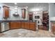 Modern kitchen with stainless steel appliances, granite countertops, and wood cabinets at 3280 Stillhouse Se Ln # 101, Atlanta, GA 30339
