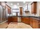 Modern kitchen with stainless steel appliances, granite countertops, and wood cabinets at 3280 Stillhouse Se Ln # 101, Atlanta, GA 30339