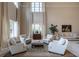 Bright living room with large windows, neutral tones, and comfortable seating arrangement at 3280 Stillhouse Se Ln # 101, Atlanta, GA 30339