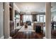 Bright living room featuring a fireplace, beautiful hardwood floors, large windows, and elegant lighting at 3280 Stillhouse Se Ln # 101, Atlanta, GA 30339
