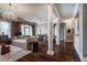 Spacious living room featuring a decorative chandelier and views of the dining area at 3280 Stillhouse Se Ln # 101, Atlanta, GA 30339