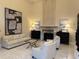 Elegant living room featuring a fireplace, sofa, and chairs in neutral tones at 3280 Stillhouse Se Ln # 101, Atlanta, GA 30339