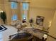 Bright, open living room with soaring windows, neutral decor, and staircase at 3280 Stillhouse Se Ln # 101, Atlanta, GA 30339