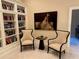 Cozy room with bookcases, painting, chairs, and marble-topped table at 3280 Stillhouse Se Ln # 101, Atlanta, GA 30339