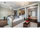 Bright living room featuring a chandelier, hardwood floors, and neutral decor with sophisticated details at 3280 Stillhouse Se Ln # 101, Atlanta, GA 30339