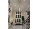 Grand entrance lobby with high ceilings, a chandelier, and staircase at 3280 Stillhouse Se Ln # 101, Atlanta, GA 30339
