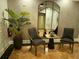 Stylish lobby features decorative mirror, seating, and a tasteful plant adding to the sophisticated ambiance at 3280 Stillhouse Se Ln # 101, Atlanta, GA 30339