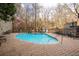 Inviting outdoor pool area with comfortable lounge chairs and lush surroundings at 3280 Stillhouse Se Ln # 101, Atlanta, GA 30339