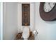 Clean and simple powder room with a toilet, decor, and a large clock at 3280 Stillhouse Se Ln # 101, Atlanta, GA 30339