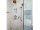 Elegant shower featuring dual shower heads, decorative niche, and glass enclosure at 3280 Stillhouse Se Ln # 101, Atlanta, GA 30339
