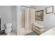 Bathroom features a tub, a toilet, and neutral decor at 9390 Knollcrest, Alpharetta, GA 30022