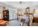 Elegant bedroom featuring a four-poster bed, French doors, and a sitting area at 9390 Knollcrest, Alpharetta, GA 30022