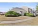 Inviting two-story home with lush landscaping, a well-maintained lawn, and a welcoming entrance at 9390 Knollcrest, Alpharetta, GA 30022