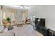 Bright living room with cozy seating, a large TV, and access to the outdoors at 9390 Knollcrest, Alpharetta, GA 30022