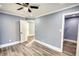 Spacious bedroom with hardwood floors and a walk-in closet at 1310 Ridgeview Rd, Auburn, GA 30011