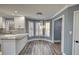 Bright kitchen with granite counters, white cabinets, and stainless steel appliances at 1310 Ridgeview Rd, Auburn, GA 30011