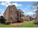 A brick house features two-story wooden decks in a beautifully landscaped backyard at 4930 Cecilia Sq, Cumming, GA 30040