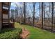 Large, well-manicured backyard, bordered by a black fence at 4930 Cecilia Sq, Cumming, GA 30040