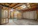 Unfinished basement with exposed beams and concrete floors at 4930 Cecilia Sq, Cumming, GA 30040