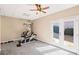Basement featuring exercise equipment and French doors to the yard at 4930 Cecilia Sq, Cumming, GA 30040