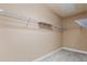 Walk-in closet featuring wire shelving and neutral carpeting at 4930 Cecilia Sq, Cumming, GA 30040
