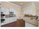 Spacious kitchen with double oven, stainless microwave, granite countertops, and tile backsplash at 4930 Cecilia Sq, Cumming, GA 30040