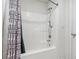 Clean bathroom boasts a shower-tub combo with a colorful curtain for a functional and vibrant space at 5330 Willow Park Blvd, Atlanta, GA 30349