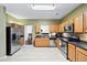 Well-equipped kitchen featuring wooden cabinets, stainless steel appliances, and tile flooring at 5330 Willow Park Blvd, Atlanta, GA 30349