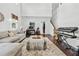 Bright and open living space with a comfortable sectional, home office nook, and hardwood floors at 5330 Willow Park Blvd, Atlanta, GA 30349