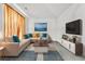 Bright and airy living room with a large sectional sofa, stylish rug, and modern entertainment center at 5330 Willow Park Blvd, Atlanta, GA 30349