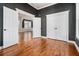 This bedroom features hardwood floors, closet, and a view of the sitting room in this well-appointed home at 970 Welch Sw St, Atlanta, GA 30310