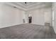 Spacious bedroom boasts plush carpeting, tray ceilings, and access to other areas of the house at 970 Welch Sw St, Atlanta, GA 30310