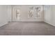A bright bedroom with neutral carpeting, white trim and a door leading to a balcony offers comfort and relaxation at 970 Welch Sw St, Atlanta, GA 30310