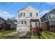 View of back exterior with wooden stairs and ample yard space at 970 Welch Sw St, Atlanta, GA 30310