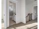 Hallway featuring carpet and staircase that leads to an upstairs bathroom with a shower and vanity at 970 Welch Sw St, Atlanta, GA 30310